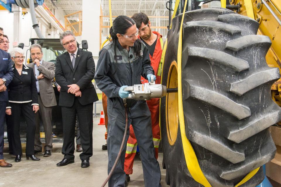 woman working on industrial tire