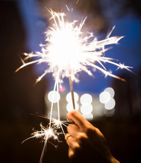 Hand holding a sparkler